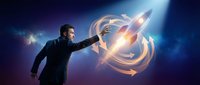 Businessman reaching toward glowing rocket launch symbol with circular energy rings against cosmic blue background for startup and innovation concepts.