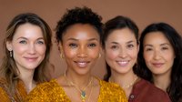 Diverse group of confident women smiling at camera, wearing casual autumn colors. Natural makeup and authentic expressions showcase genuine connection and inclusivity.