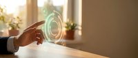 Businessman hand touching glowing digital holographic interface with circular light effects in modern office environment for technology presentations.