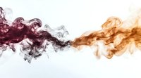 Purple and orange smoke clouds swirling together on white background creating abstract fluid motion pattern for creative design projects.