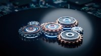 Metallic gears and cogs machinery parts on dark surface with spotlight illumination for industrial engineering and mechanical design concepts.