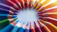 Vibrant colored pencils arranged in circular pattern creating sunburst effect against white background, sharp tips pointing inward. For education and creativity concepts.