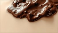 Melted dark chocolate swirl with smooth glossy texture and flowing waves creates appetizing background for confectionery and dessert designs.