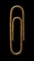Antique brass paper clip isolated on transparent background, ready for design use on t-shirts, clipart, stickers, print-on-demand products, and digital crafts.