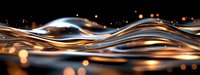 Flowing liquid metal waves with golden light reflections creating dynamic abstract motion against dark background for modern design projects.