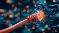 Orange network cable connector with glowing digital data visualization and binary code on dark background with bokeh lights. Suitable for cybersecurity concepts.