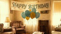 Vintage living room decorated with teal and gold balloons under a Happy Birthday banner, warm retro atmosphere for celebration concepts.