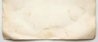 Vintage aged parchment paper texture with natural brown stains and weathered edges for antique document design backgrounds and historical projects.