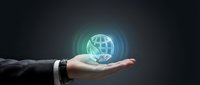 Professional businessman hand presenting glowing digital globe hologram representing global business connectivity and worldwide network solutions.