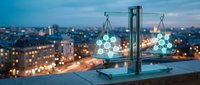 Modern balance scale with glowing spheres against city skyline at dusk, symbolizing justice, equality and fair judgment in urban business environment.