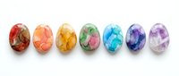 Seven colorful painted Easter eggs arranged in rainbow order from red to purple, each featuring unique watercolor floral and abstract designs, isolated on white background for holiday decoration and seasonal design projects.
