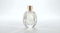 Transparent glass perfume bottle with gold cap isolated on white background, ready for product packaging design, cosmetics advertising, and beauty branding applications.