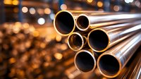 Industrial metal pipes with circular cross sections arranged diagonally against blurred warm bokeh background, showcasing construction materials and metallurgy.