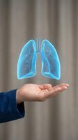 Holographic blue lungs floating above open palm representing respiratory health, medical care, and pulmonary wellness concepts for healthcare presentations.