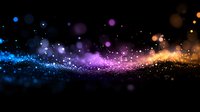 Magical glowing particles flowing in dark space with vibrant blue, purple, and orange colors creating dreamy bokeh effect and sparkling light trail.