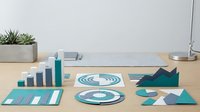 Business analytics dashboard with teal charts, graphs and data visualization elements on modern office desk for corporate presentations and reports.