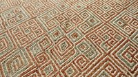 Intricate geometric pattern with diamond shapes in earthy tones of brown, beige and green creating a sophisticated textile design for home decor applications.