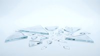 Shattered glass pieces scattered on white surface, sharp fragments and splinters from broken transparent pane.
