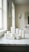 White cosmetic packaging collection on marble surface in bright bathroom interior for skincare and beauty product branding.