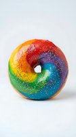 Colorful rainbow glazed donut with sprinkles and vibrant gradient icing in red, orange, yellow, green, blue, and purple tones on white background for bakery and food design.