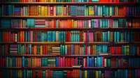 Colorful vintage books arranged on wooden library shelves creating rainbow pattern background. Multicolored spines of old hardcover books fill entire frame.