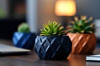Small succulent plants in decorative geometric planters on modern desk workspace with warm ambient lighting for home office decor and interior design.