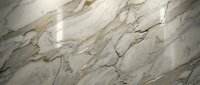 Elegant white marble surface with golden veins and natural stone texture for luxury interior design and architectural applications.