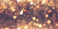 Magical glowing bokeh lights creating dreamy atmosphere with golden and orange circles on dark background, festive holiday abstract pattern.