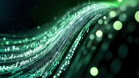 Abstract digital wave of green light particles flowing with bokeh effect, representing technology, data streams, and futuristic connectivity.