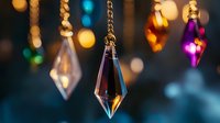 Elegant crystal pendant necklaces with golden chains creating luxurious jewelry display against colorful bokeh lights background for fashion accessories.