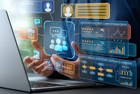 Business professional using laptop with holographic customer relationship management dashboard displaying analytics charts and user profiles for digital marketing.