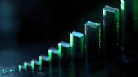 Ascending green glowing bars create dynamic financial growth visualization against dark background, with bokeh light effects and shallow depth of field.