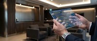 Smart home automation control system with transparent tablet interface showing IoT connectivity in modern luxury living room with ambient lighting.
