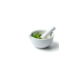 White ceramic mortar and pestle with fresh green basil leaves isolated on white background for cooking and herbal medicine preparation.
