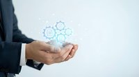 Business professional holding digital technology icons representing data management and connectivity solutions for modern workplace innovation.