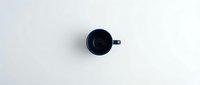 Dark blue ceramic mug with handle on white background, isolated and ready for product mockups, web design, and e-commerce applications.