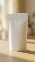White blank stand up pouch with zip lock closure on wooden surface. Mockup template for food packaging, coffee, tea, snacks branding and product design.