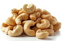 Heap of roasted cashew nuts isolated on white background, nutritious protein-rich snack for healthy eating and cooking.