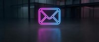 Glowing neon email envelope icon with pink and blue gradient lighting on dark modern office background for digital communication and marketing concepts.