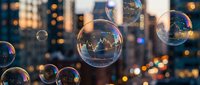 Soap bubbles floating against blurred city lights at dusk creating magical urban atmosphere with bokeh effect and warm golden hour lighting.