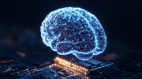 Glowing blue brain hologram floating above electronic circuit board with neural connections and digital pathways representing artificial intelligence technology.