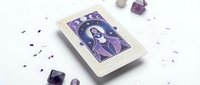 Mystical tarot card with purple crystal gems and amethyst stones on white background for spiritual divination and fortune telling practices.