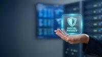 Data protection shield icon glowing in hand of professional against server room background, representing cybersecurity, privacy compliance, and digital safety for enterprise networks.