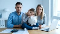Caucasian family with young boy holding piggy bank at home office desk with laptop planning finances and savings for future education expenses.