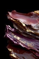 Abstract purple and brown layered texture with gold accents on black background, creating dramatic luxury art composition with metallic highlights and deep shadows.