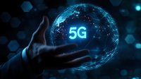 Futuristic digital globe with glowing 5G text hovering above human hand against dark background with network connections representing next-generation wireless technology.