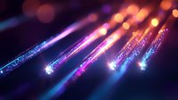 Fiber optic cables with glowing ends transmitting data in purple and orange light against dark background for technology and communication concepts.