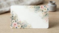 Blank floral greeting card with watercolor roses, daisies and eucalyptus leaves in corners on wooden surface for wedding invitations and stationery design.