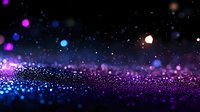 Magical glowing particles in purple and blue colors against dark background with bokeh effect and sparkles creating dreamy atmosphere.