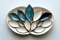 Ceramic lotus flower plate with white and turquoise petals featuring crackle glaze effect and gold trim details, handcrafted decorative piece for home decor and tableware styling.